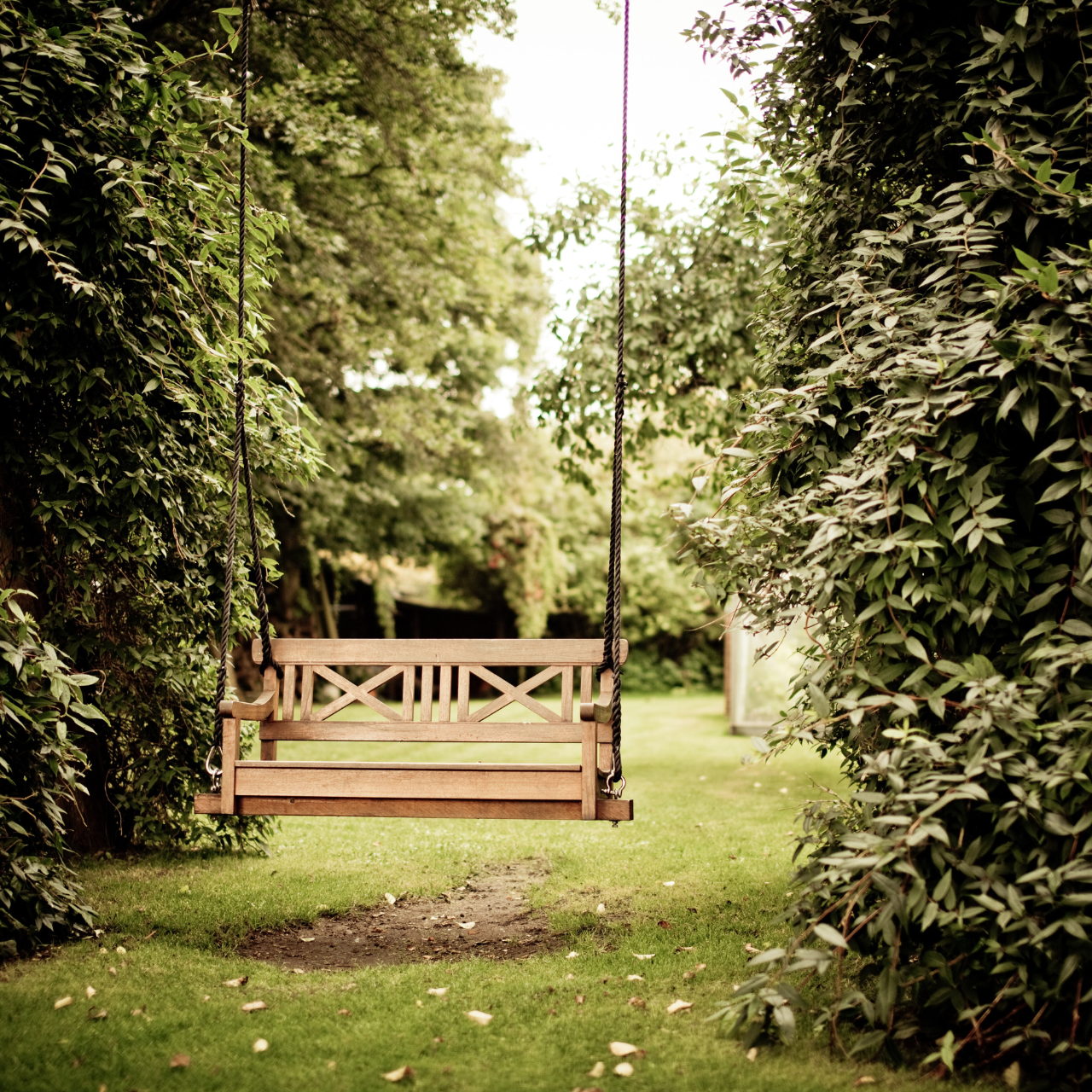 Creating a Backyard Oasis: How to Incorporate a Swing Set into Your Landscaping